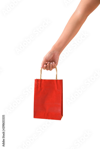 Female hand holding red papaer shopping bags
