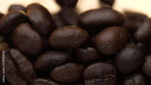 Coffee beans filling in a drinking glass, Slow motion and close-up coffee beans