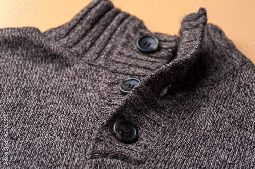 Close-up of a gray knitted warm jacket