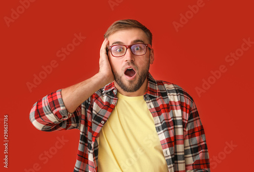 Surprised young man on colo...