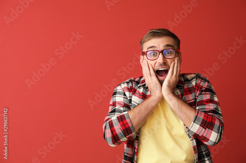 Surprised young man on colo...