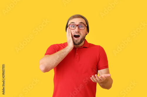 Surprised young man on colo...