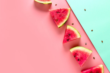 Slices of sweet ripe watermelon on color background