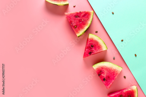 Slices of sweet ripe watermelon on color background photo