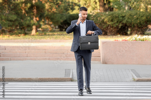 Handsome businessman on ped...