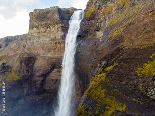 Dramatic overview of Haifoss waterfall, the fourth highest waterfall(122m) of the island, and colorful canyon situated near the volcano Hekla in southern Iceland..