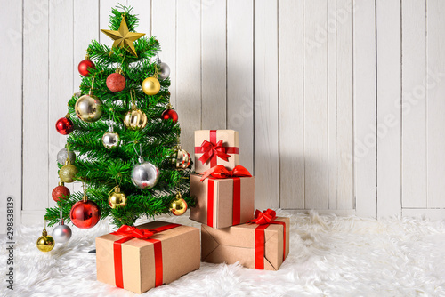 Christmas tree and ornaments with gifts boxes