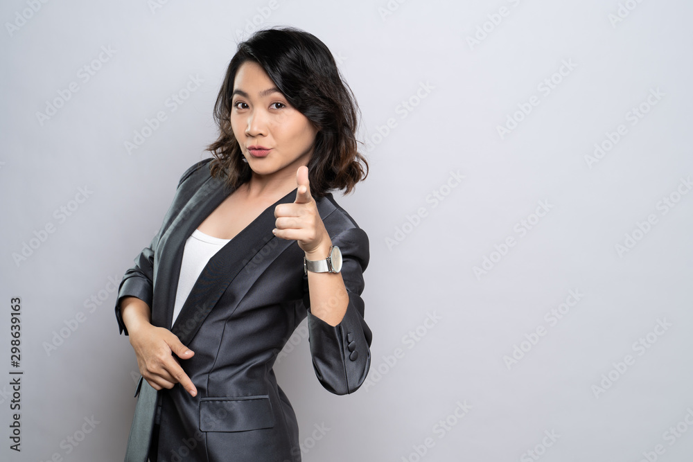 Woman point finger and looking at camera isolated on white background Woman point finger and looking at camera isolated on white background
