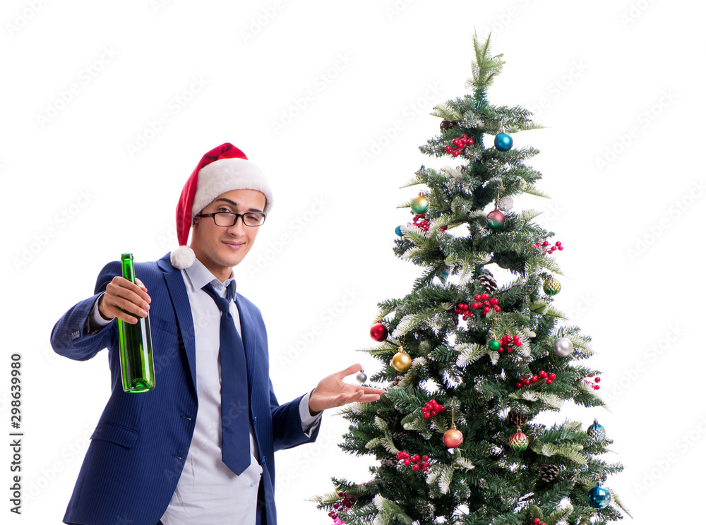 Businessman decorating christmas tree isolated on white Businessman decorating christmas tree isolated on white