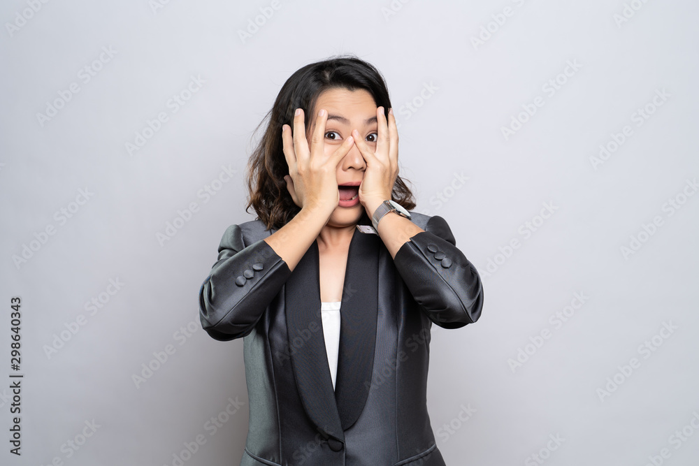 Woman feel scared standing isolated over white background Woman feel scared standing isolated over white background