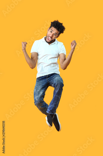 Portrait of jumping African...