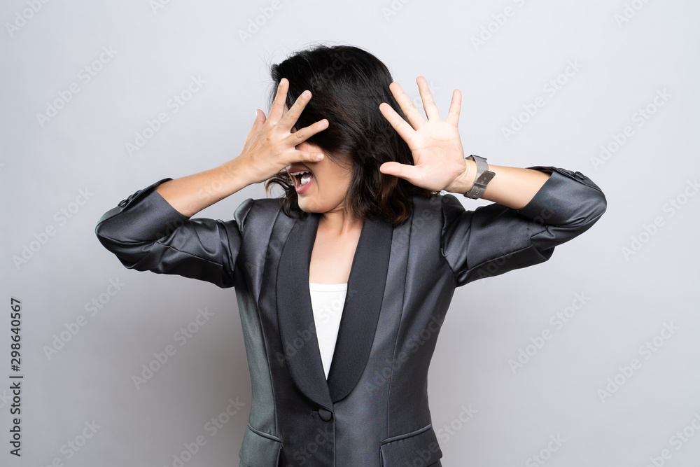 Woman feel scared standing isolated over white background Woman feel scared standing isolated over white background