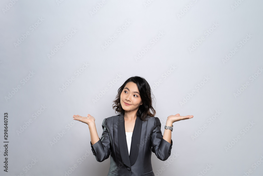 Portrait of a confused woman isolated over white background Portrait of a confused woman isolated over white background