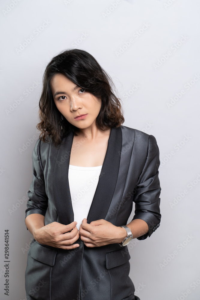 Portrait of a confident woman standing isolated over background Portrait of a confident woman standing isolated over background