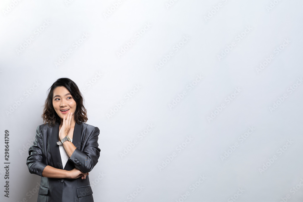 Happy woman thinking and standing isolated over white background Happy woman thinking and standing isolated over white background