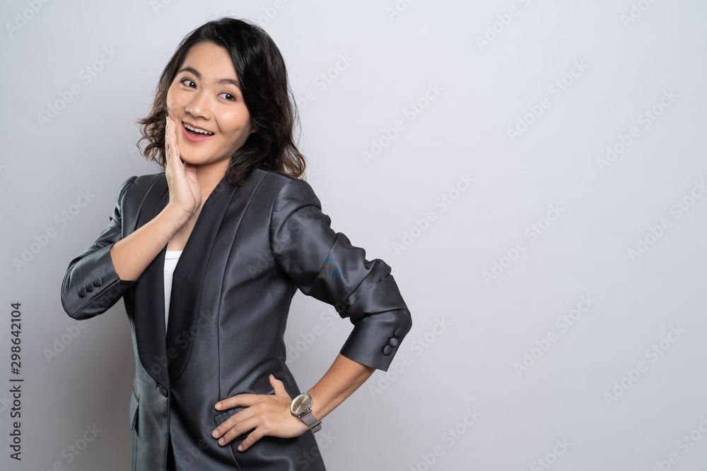 Happy woman thinking and standing isolated over white background Happy woman thinking and standing isolated over white background