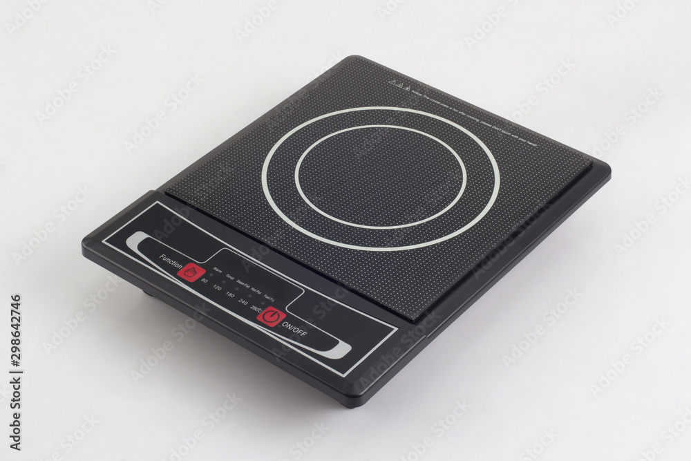 portable induction hob with touchpad isolated on white portable induction hob with touchpad isolated on white