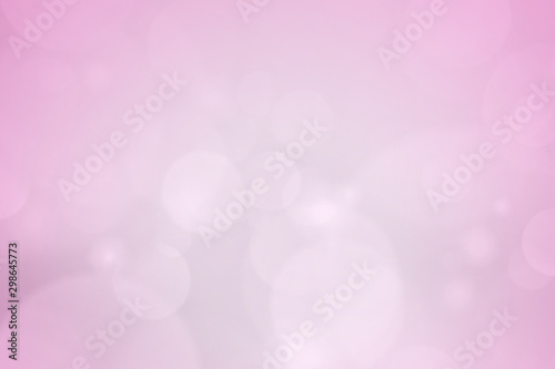 abstract blur white bokeh circles on pink background.