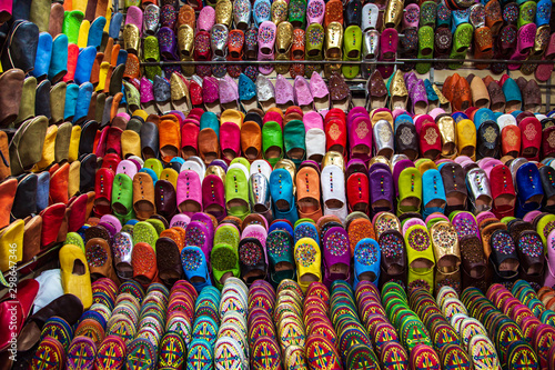 Traditional vibrant Moroccan slippers - "babouches" on the market. © lizavetta