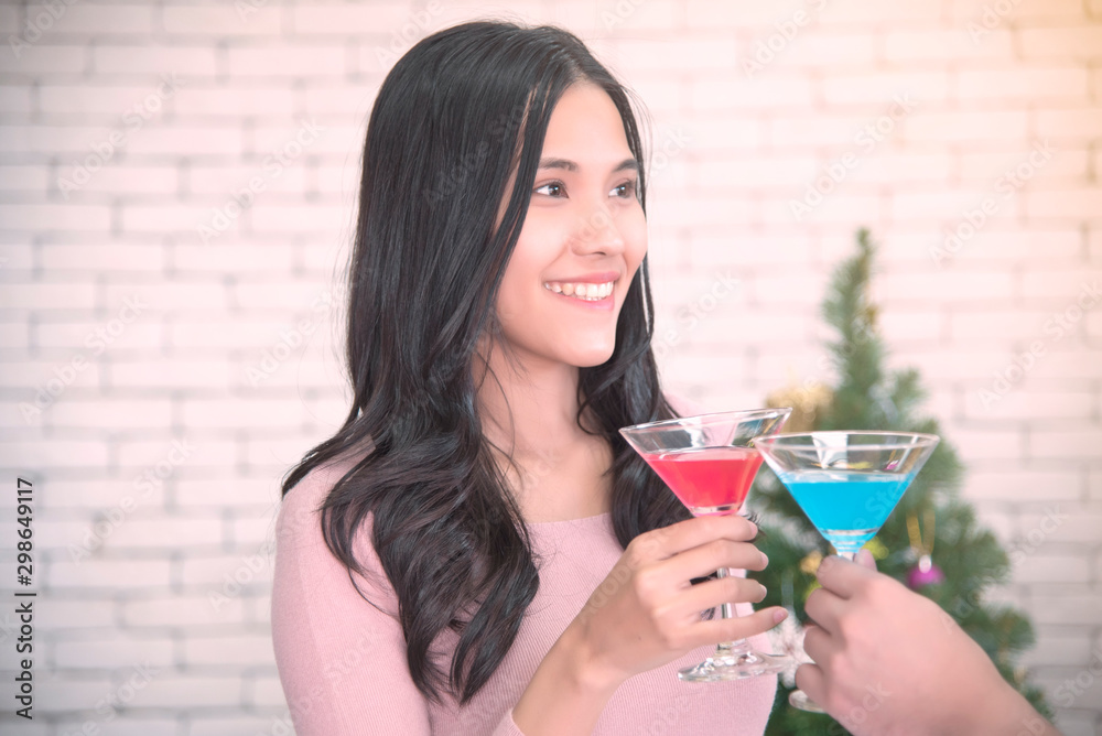 Young Asian couples are celebrating Christmas festivities in a warm, fun-filled, holiday-filled, high-end Christmas and New Year holiday concept. Young Asian couples are celebrating Christmas festivities in a warm, fun-filled, holiday-filled, high-end Christmas and New Year holiday concept.