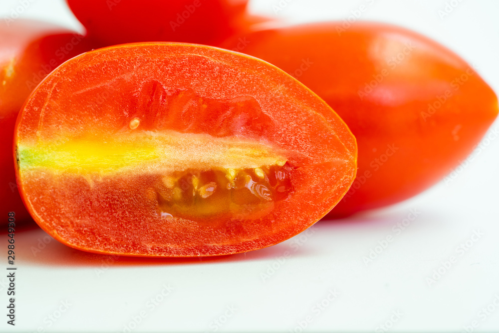 Close up fresh cherry tomato in wooden spoon on wood background. Close up fresh cherry tomato in wooden spoon on wood background.