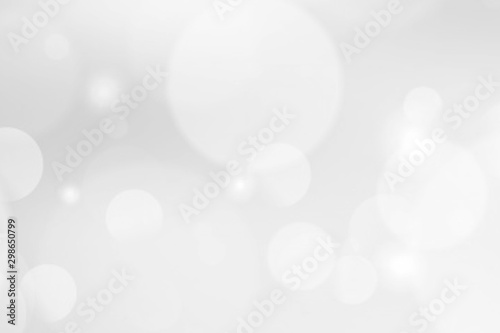 abstract blur white bokeh circles on gray background.