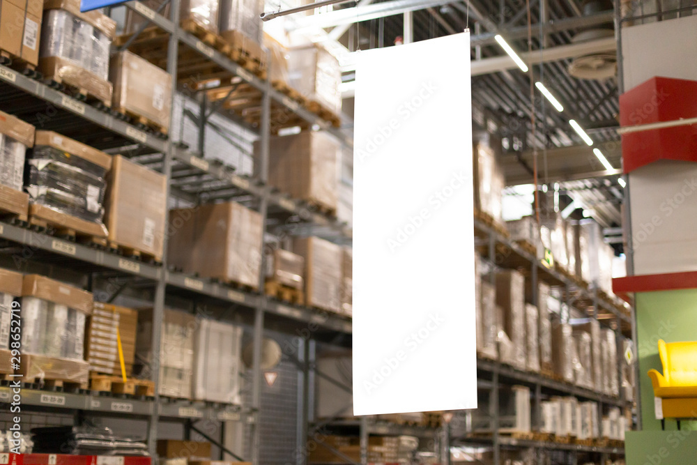 Blank mock-up advertising with copy space in the warehouse (storage) with rows of shelves with goods boxes