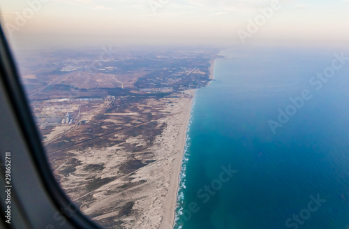 View early in the morning at sunrise of Tel Aviv city from the window of a flying airplane, Tel Aviv in Israel