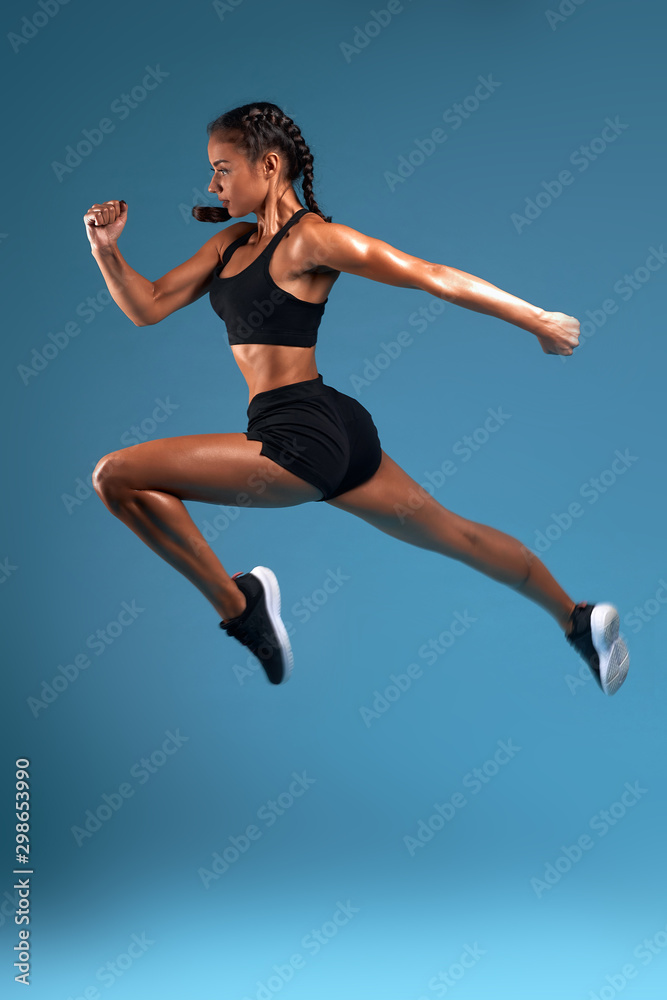 young girl leaving her workplace on Friday, full length side view photo. isolated blue background, studio shot, hobby interest, professional sport. sportswoman is reaching her goal