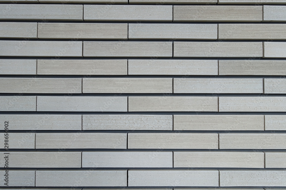 テクスチャ 櫛引タイルの壁面 Texture Of Beige Color Brick Wall Stock Photo Adobe Stock