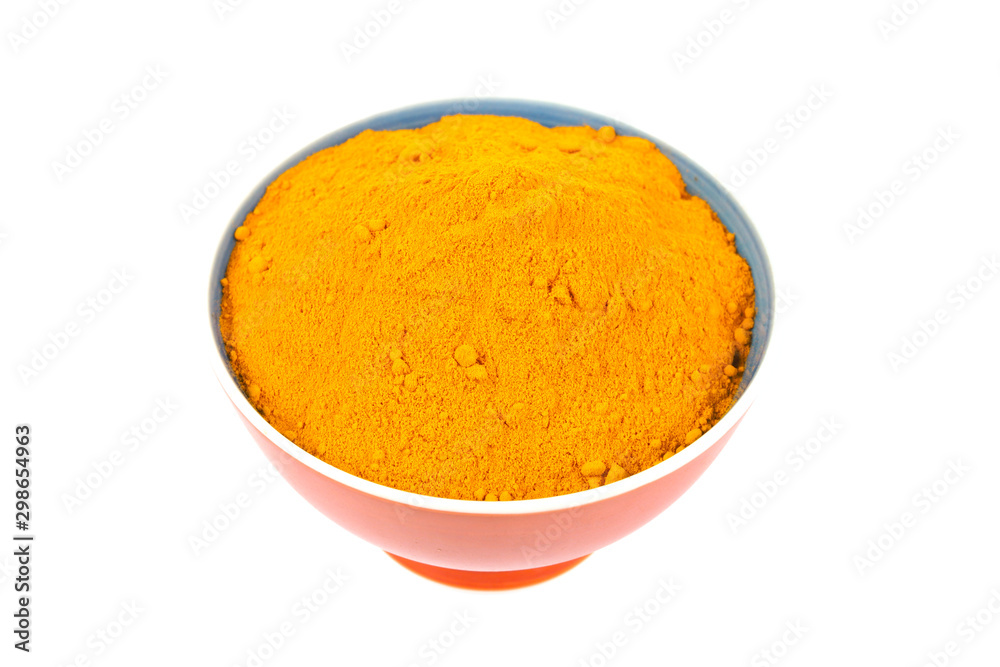 Turmeric powder (Curcuma) in brown bowl on white background. herbal Turmeric powder (Curcuma) in brown bowl on white background. herbal
