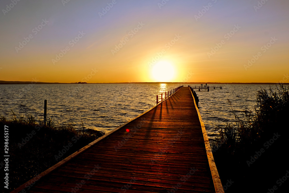 Jetty on a lake during sunset