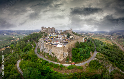 Aerial view of Obidos castle and walled medieval town in Central Portugal one of the seven wonders of Portugal with a pousada luxury hotel popular tourist destination photo