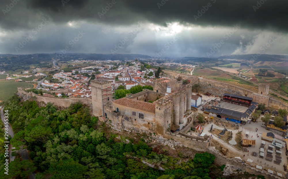 Aerial view of Obidos castle and walled medieval town in Central Portugal one of the seven wonders of Portugal with a pousada luxury hotel popular tourist destination