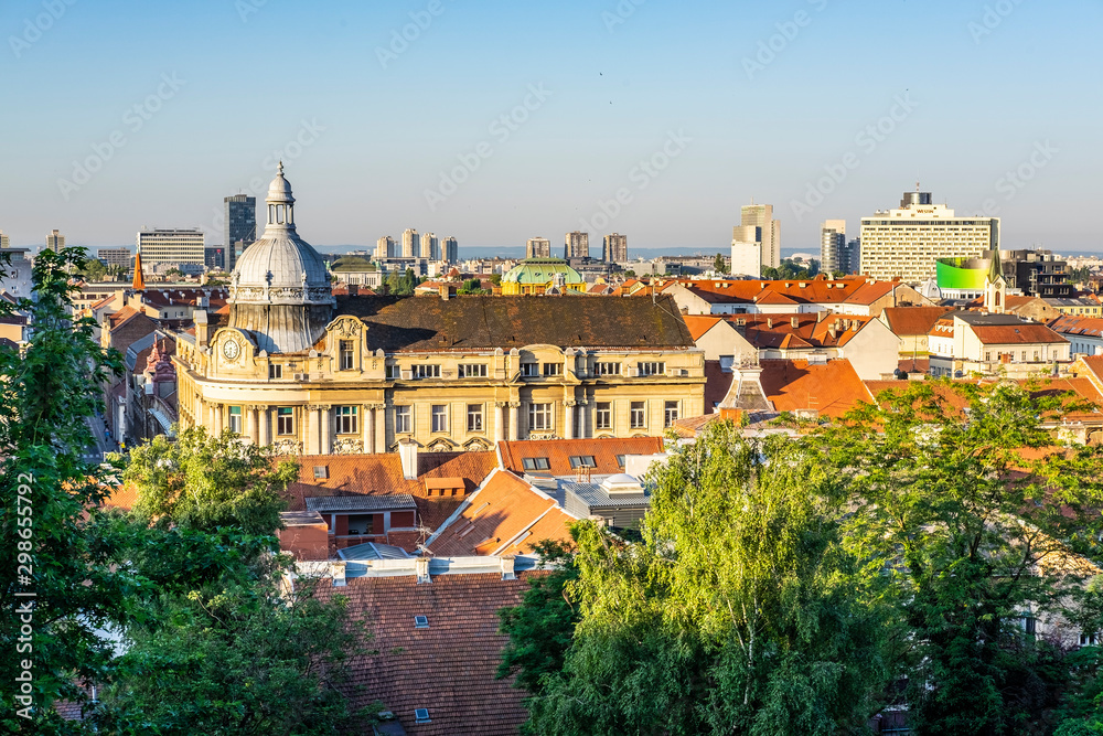 View on Zagreb Down Town with green trees, red roofs and skyscrapers with blue summer sky, Croatia, popular touristic destination