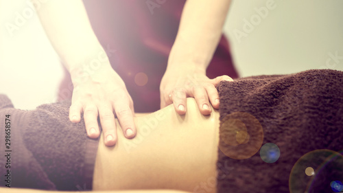 Treatment massage for weight loss in spa salon. Massage back for woman. Spa massage for correction figure.