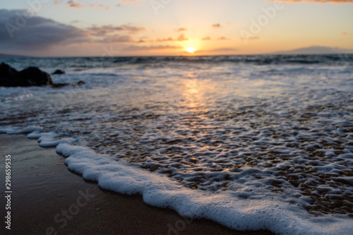 Gentle wave brushes the beautiful coast of Maui, Hawaii