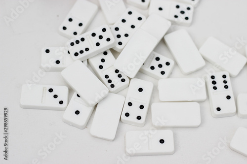 Traditional miniature dominos as a wedding gift.Pieces of dominos on a white background