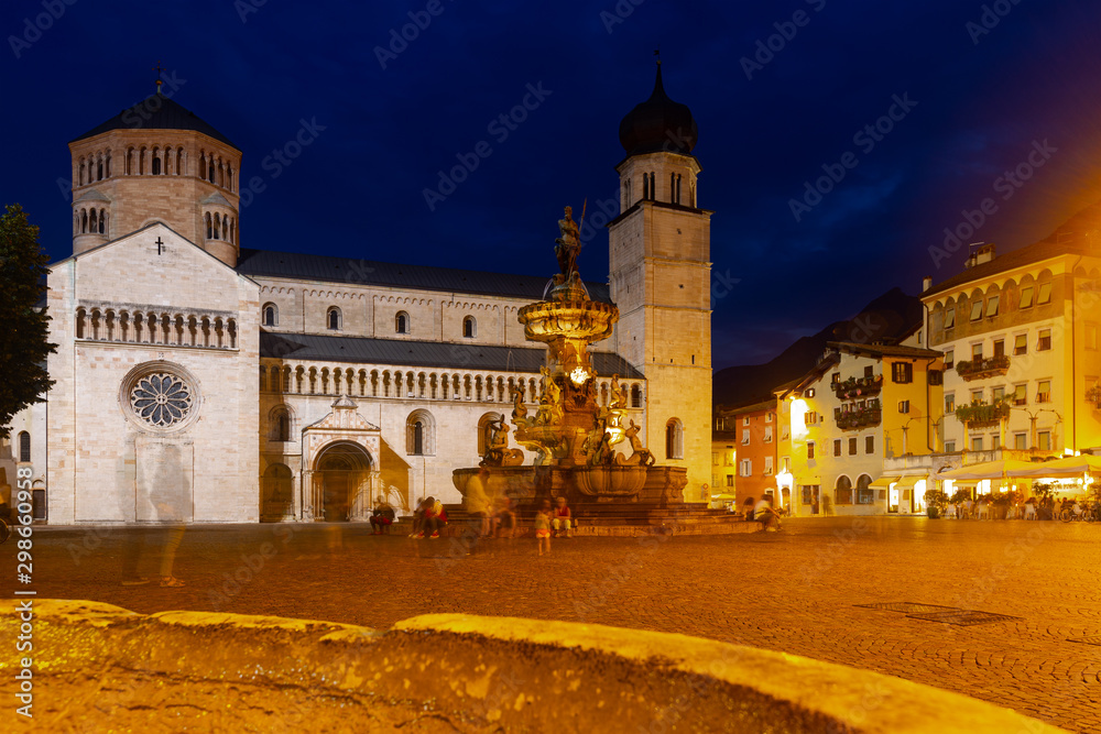 Nettuno Fountain in Duomo square and Civic tower. Trento. Italy