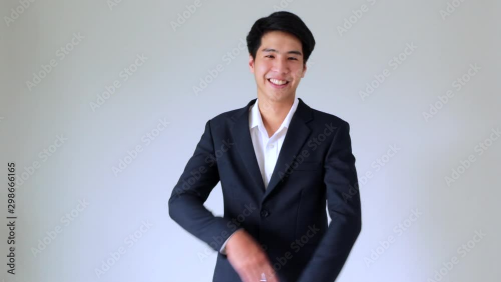 Happy young asian handsome smiling businessman Happy young asian handsome smiling businessman