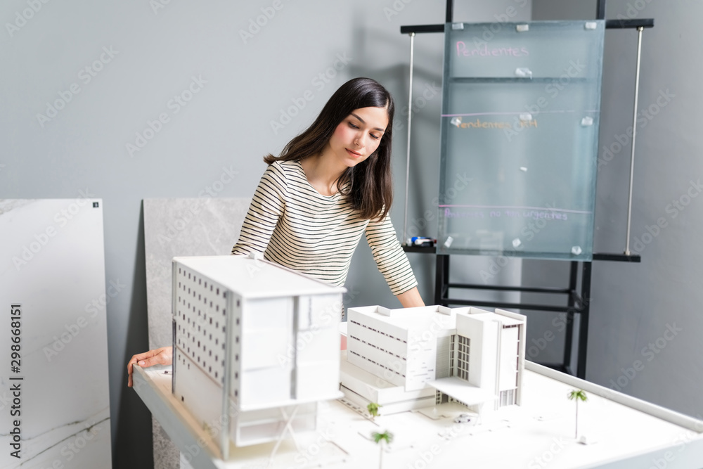 Engineer Examines Model At Workshop Engineer Examines Model At Workshop