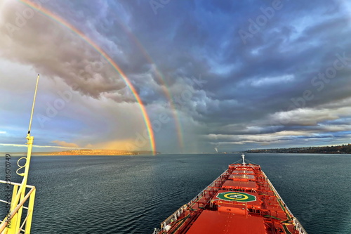 Colorful views of the rainbow against the sky, clouds and sea horizon. Commencement Bay,Tacoma,USA      A.