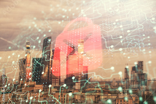 Double exposure of lock icon hologram on cityscape background. Concept of data security