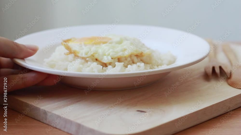 Serving steamed rice with fried eggs on table. Serving steamed rice with fried eggs on table.