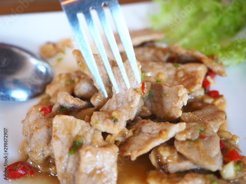 Stir fried pork with three flavors of Thai food on the table