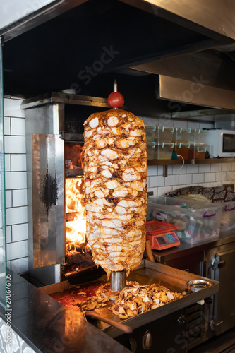 Traditional Turkish Doner Kebab meat. Shawarma or gyros. Turkish, greek or middle eastern arab style chicken doner kebab food in restaurant.