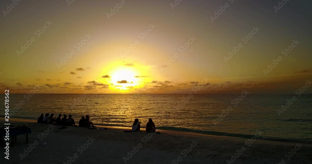 Best friends enjoying sunset on the tropical sandy beach, Golden hour seascape Best friends enjoying sunset on the tropical sandy beach, Golden hour seascape