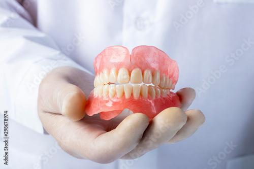 False teeth prosthesis. Doctor Dentist.