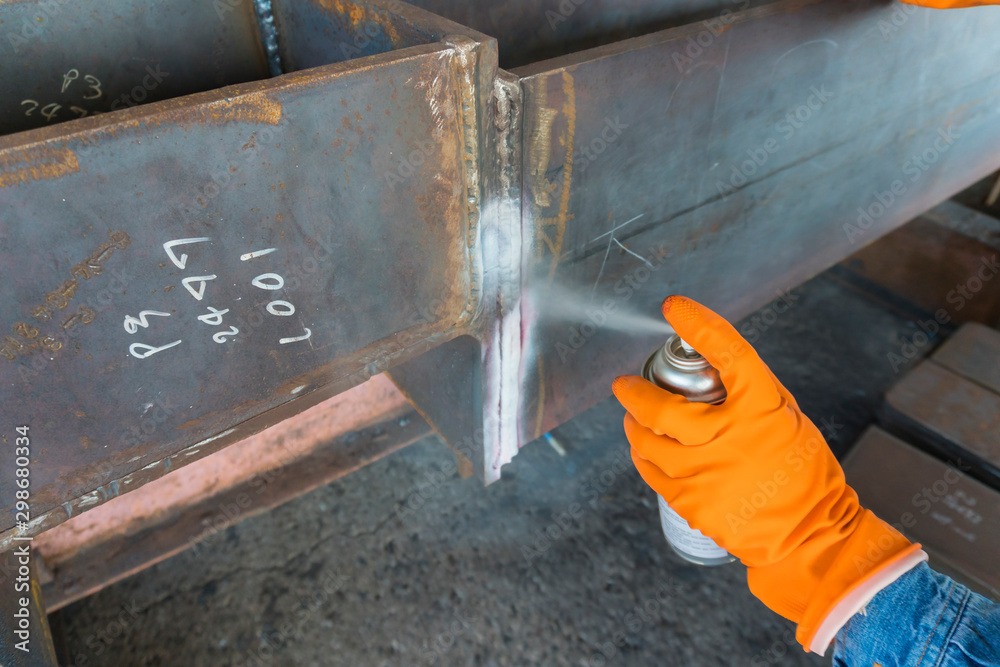Step to use Developer spray into the welded for Non-Destructive  Testing(NDT) with process Penetrant Testing(PT). Photos | Adobe Stock