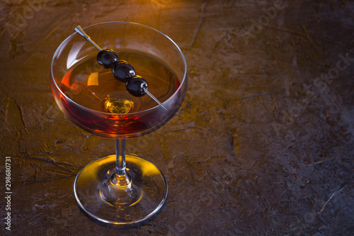 Manhattan cocktail on fireplace background